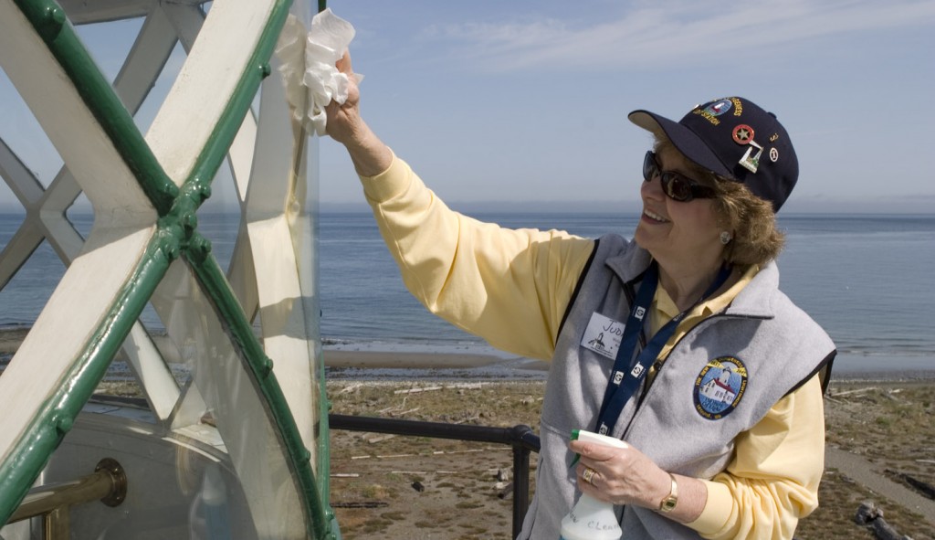 Lighthouse Keeper washing lantern window